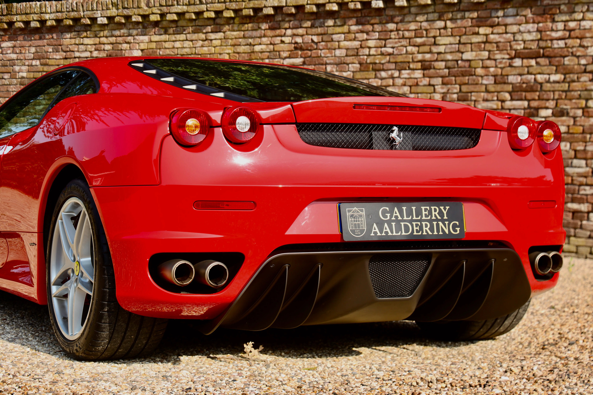 The back of a red Ferrari F430 Novitec Rosso super car Stock Photo The back of a red Ferrari F430 Novitec Rosso super car Stock Photo